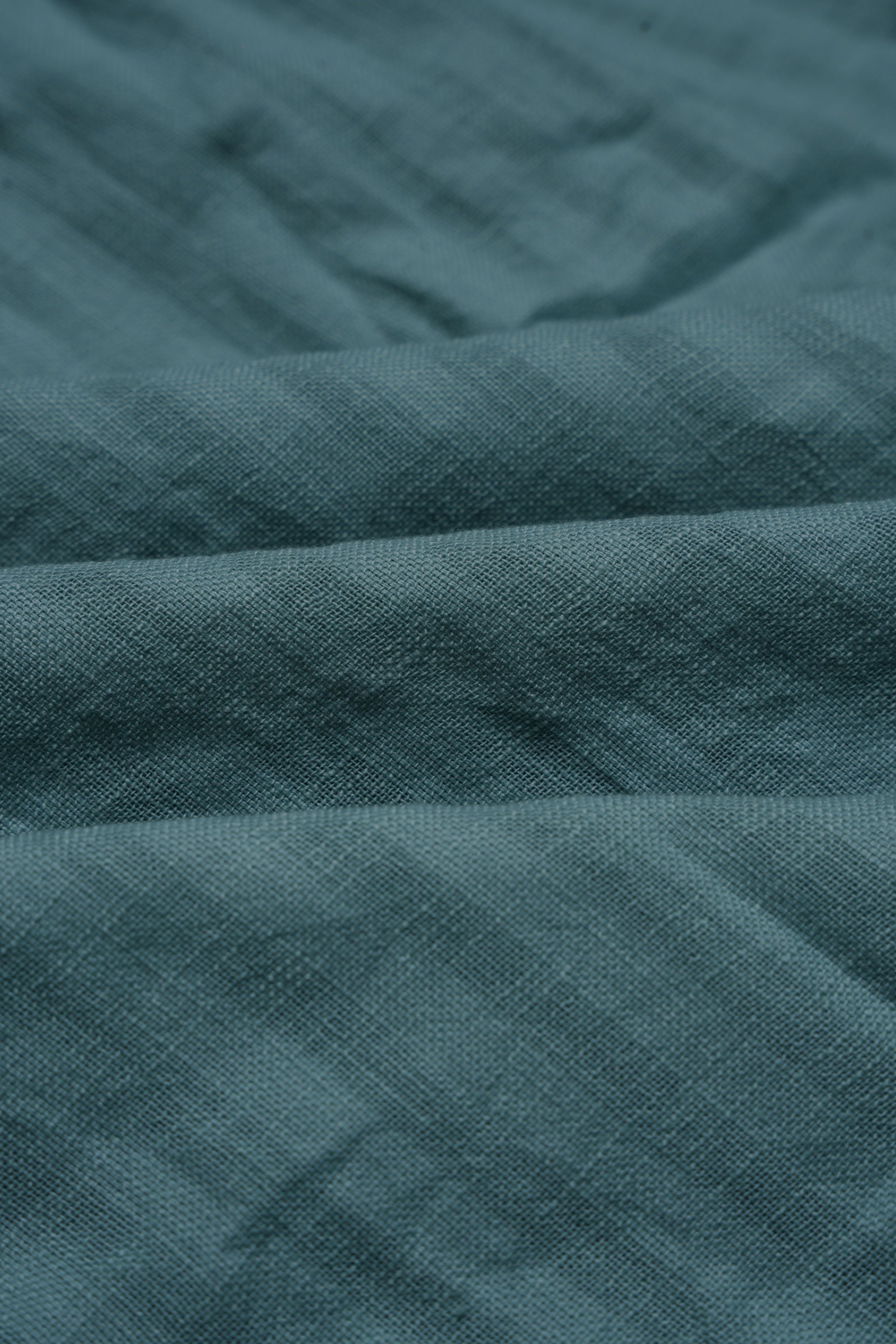 Mint green striped shirt fabric detail